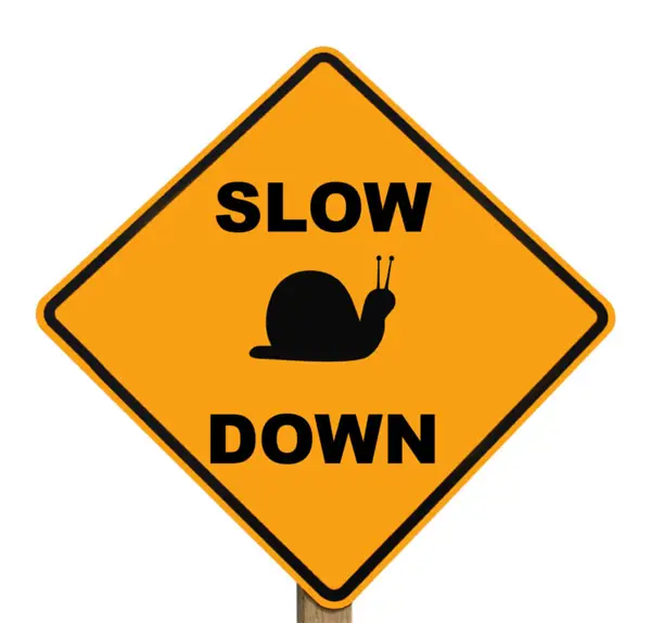 slow down sign with number plate